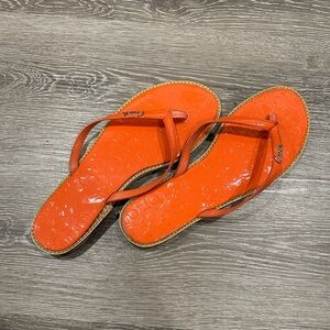 Coach Devlynn sandals in orange, soft patent leather finish. Size 8.5